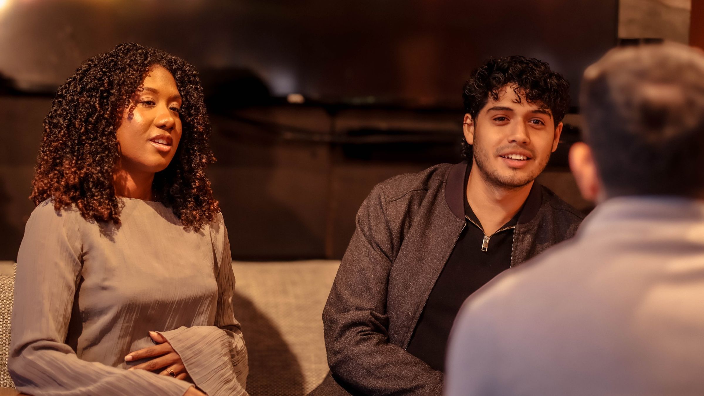 Emmanuelle and Adrian in conversation with a client